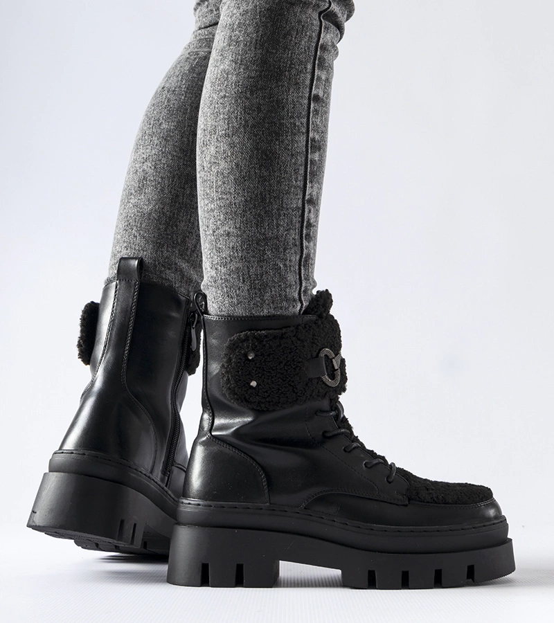 Čierne zateplené workery s patentovou sponou Highland.